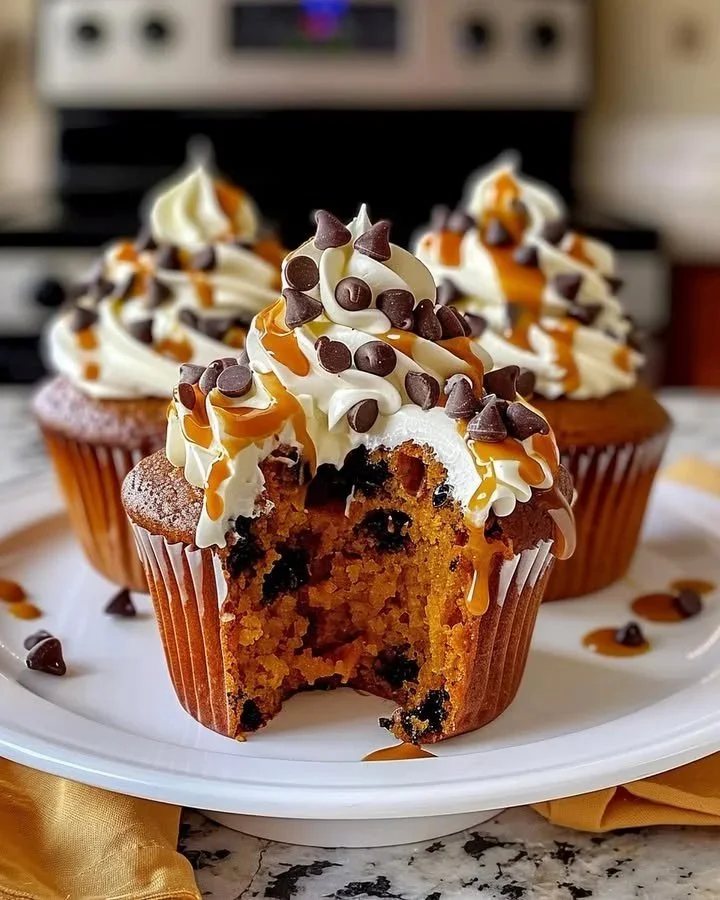 Decadent buttercream frosted pumpkin chocolate cupcakes ready to enjoy.