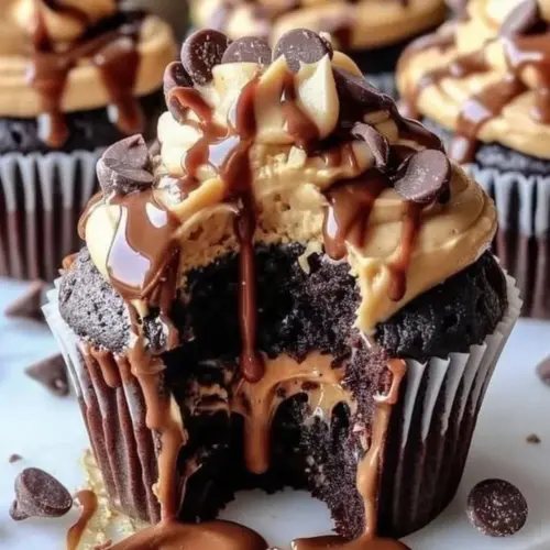 Delicious molten peanut butter cupcake topped with creamy frosting