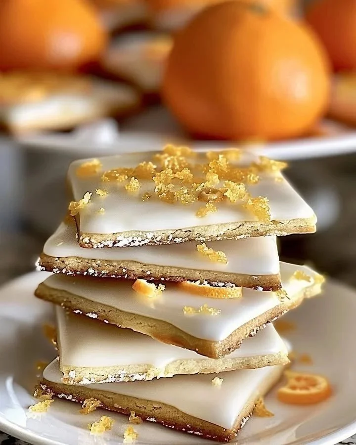 Orange Glazed Cardamom Shortbread cookies on a plate
