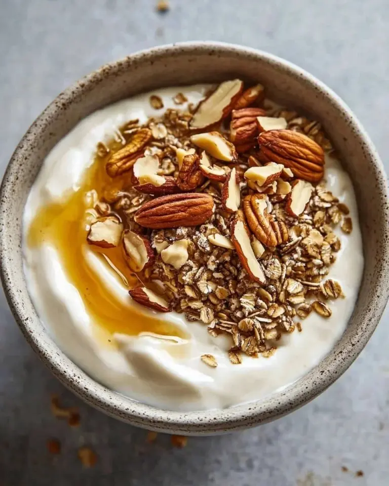 Pumpkin pie yogurt parfait with layers of yogurt, pumpkin, and spices